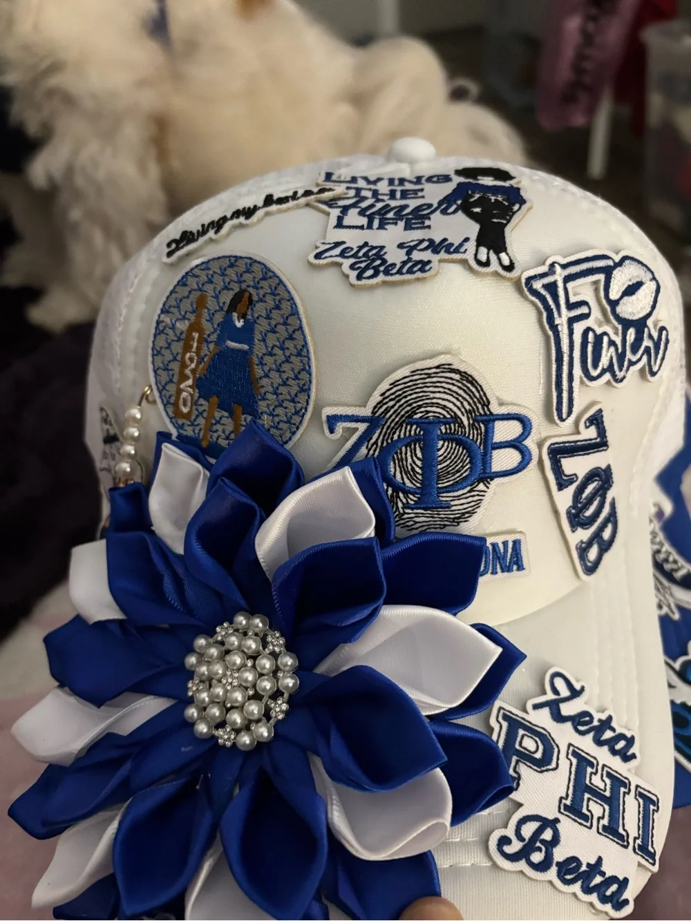 White Hat with Blue & White Flower Appliqué